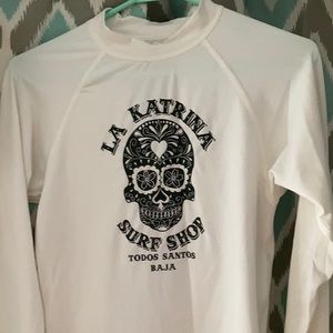 White rash guard with skull
